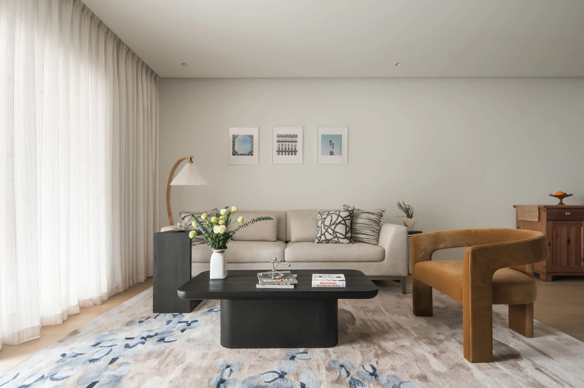Great room of C Residence in warm neutrals with walnut wood joinery