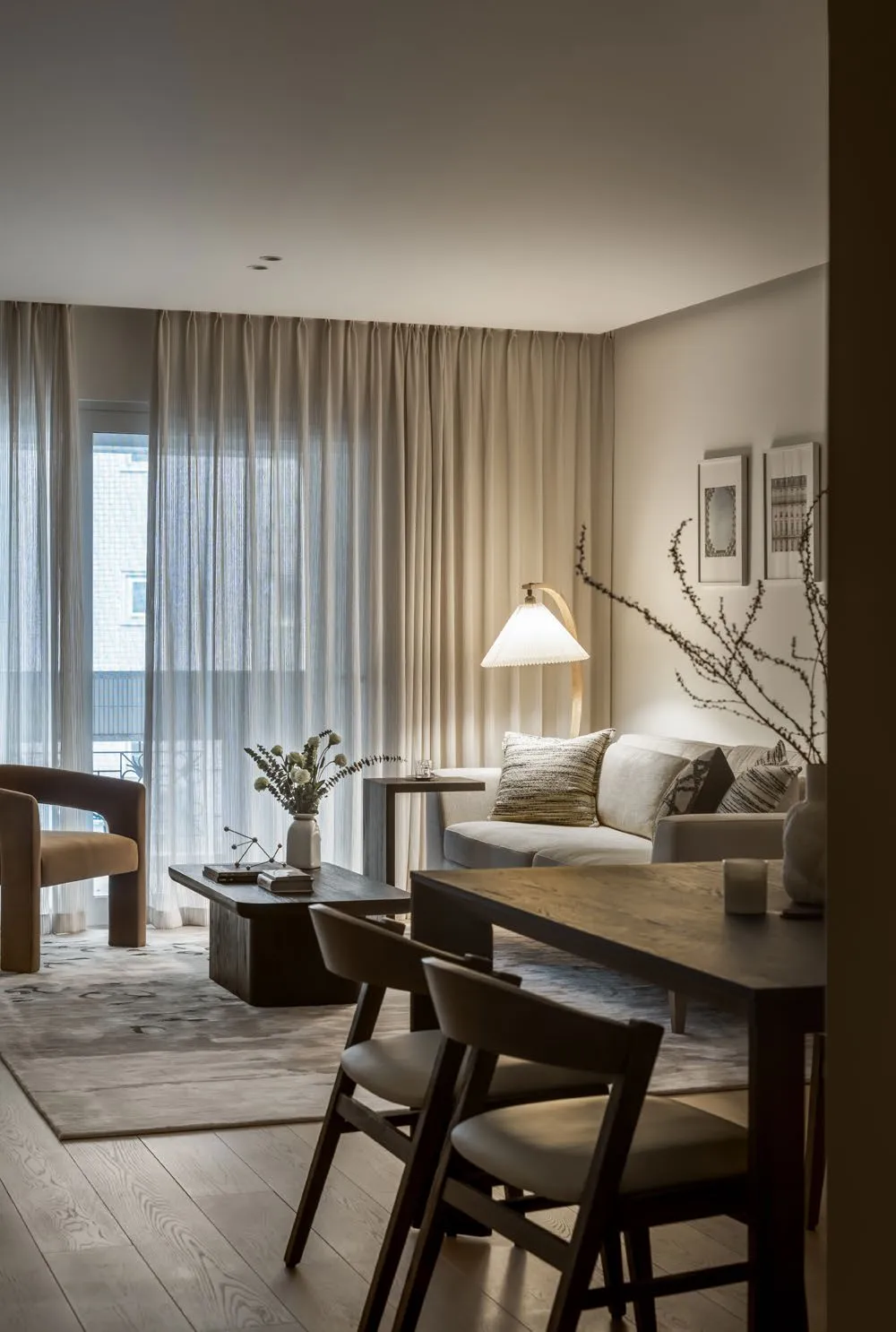 Great room of C Residence in warm neutrals with walnut wood joinery