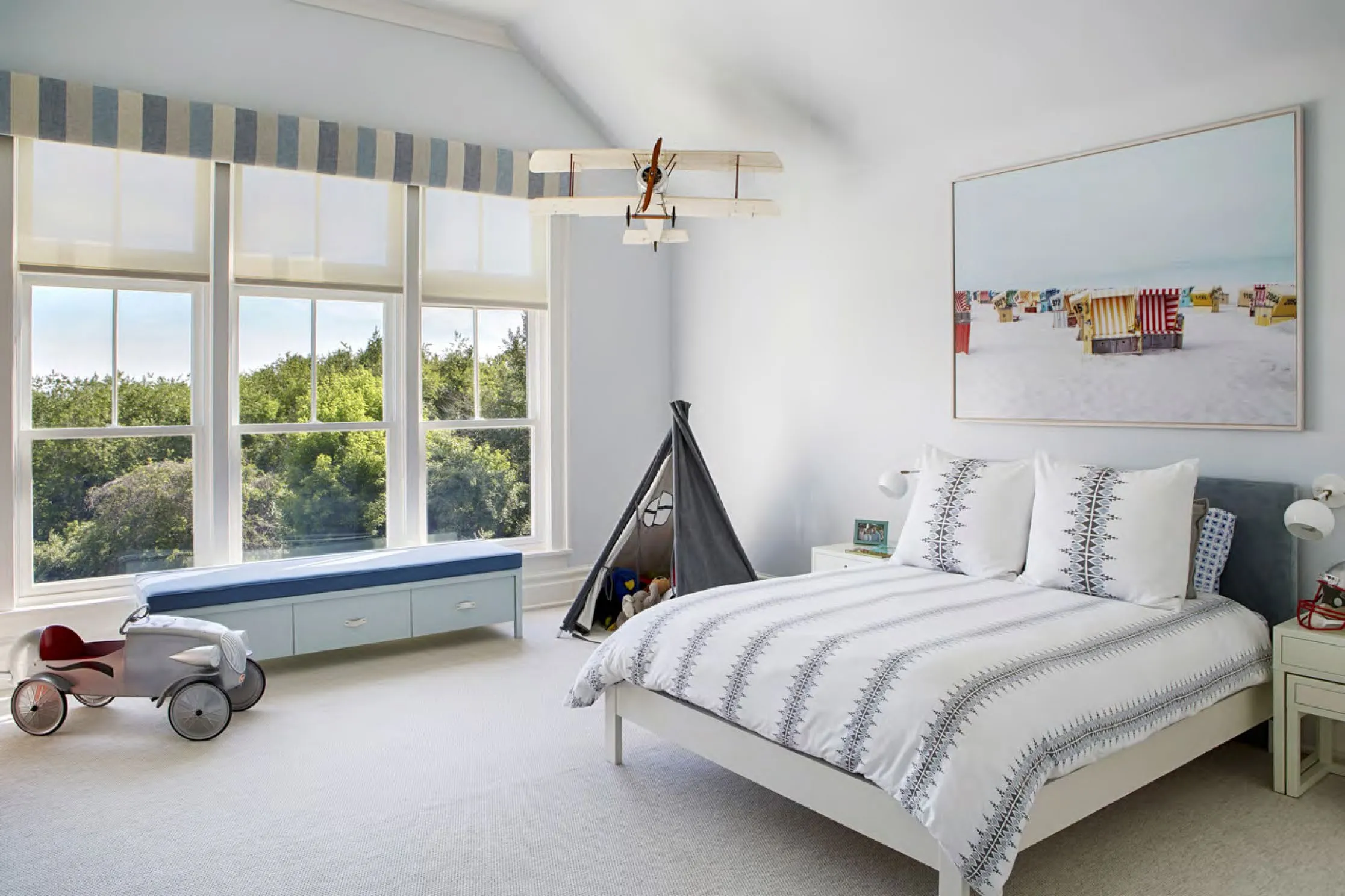 Bedroom of L Beach House in soft blue and white